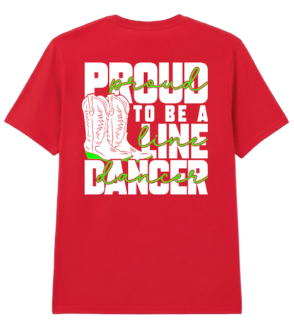 A red short-sleeve t-shirt with a graphic on the back that reads 'PROUD TO BE A LINE DANCER' in white and green script, featuring an illustration of white cowboy boots in the center, shown against a light gray background.